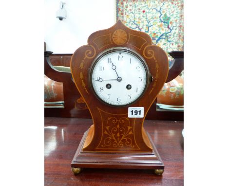 AN EDWARDIAN MAHOGANY AND INLAID MANTLE CLOCK WITH ENAMEL DIAL AND FRENCH STRIKING MOVEMENT.