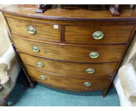 A REGENCY MAHOGANY BOW FRONT CHEST OF TWO SHORT AND TWO LONG DRAWERS ON SPLAYED BRACKET FEET.