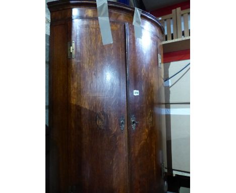 A GEORGIAN OAK AND INLAID BOW FRONT CORNER CABINET