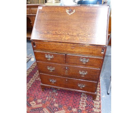 A SMALL GEO.III.OAK COUNTRY MADE BUREAU WITH STEP FITTED INTERIOR OVER TWO SHORT AND TWO LONG DRAWERS.