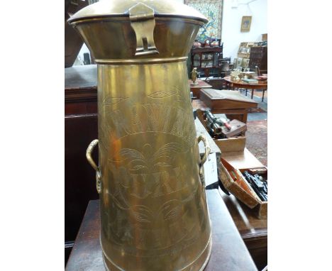 A VINTAGE TAPERED FORM POLISHED BRASS TWIN HANDLED MILK CHURN INSCRIBED GUARANTEED PURE MILK, SKIDMORE &amp; SON. H.58cms.