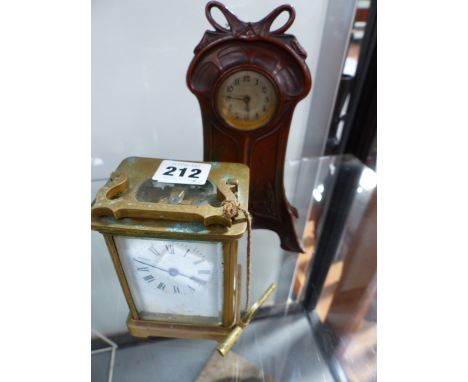 AN ART NOUVEAU CASED DRESSING TABLE CLOCK TOGETHER WITH A FRENCH BRASS CARRIAGE CLOCK
