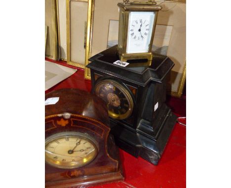 A VICTORIAN BLACK SLATE MANTLE CLOCK, A CARRIAGE CLOCK AND AN EDWARDIAN INLAID DESK CLOCK.