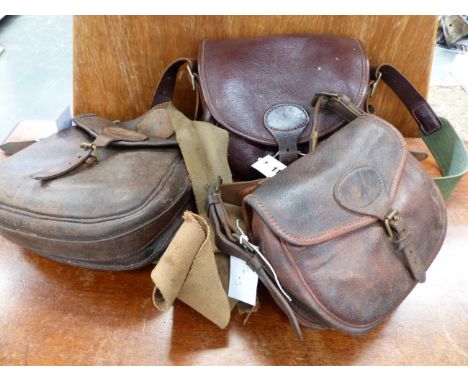 THREE VINTAGE LEATHER CARTRIDGE BAGS