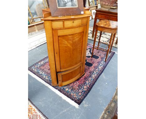 A 19TH.C.SATINWOOD BOW FRONT CORNER CABINET, WITH SMALL DRAWER OVER TWO PANEL DOORS BELOW.