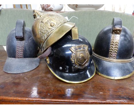 FOUR VINTAGE FIREMAN'S HELMETS