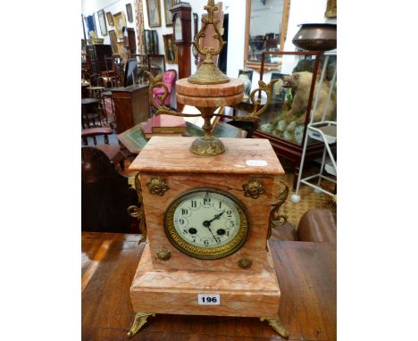 A FRENCH PINK MARBLE CASED MANTLE CLOCK WITH ENAMELLED DIAL AND BELL STRIKING MOVEMENT.