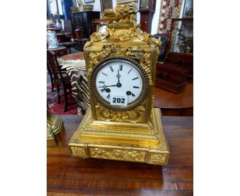 A 19TH.C.FRENCH BRONZE ORMOLU MANTLE CLOCK WITH ENAMEL DIAL AND BELL STRIKE MOVEMENT.