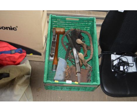 A plastic crate of various hand tools