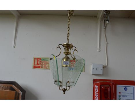 A brass and glass light fitting 