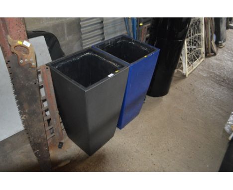 A large blue and grey planter