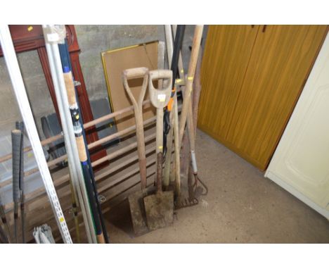 A quantity of long handled garden tools 