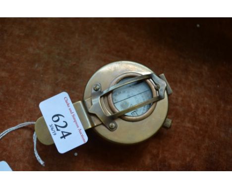 A brass cased compass (97)