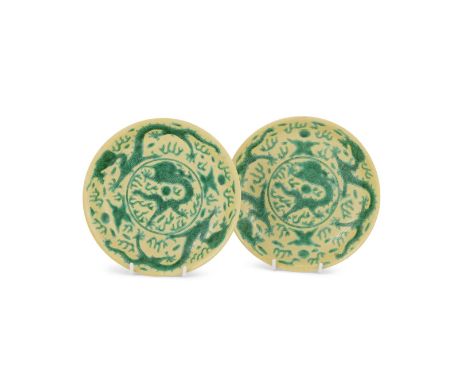 A pair of Chinese yellow and green glazed 'Dragon' plates, 19th century, enamelled to the interior with five-clawed dragons c