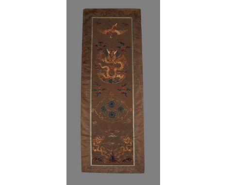 A Chinese silk embroidered chair cover, Kangxi, 17th century, the upper register with a crane, the chair back with a five-cla