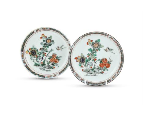 A pair of small Chinese Famille Verte dishes, Kangxi, painted to the interior with magpies and flowering branches issuing fro