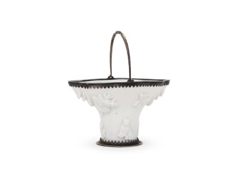 A Chinese Dehua silver mounted libation cup, 17th century, moulded in the form of a rhinoceros horn libation cup, one side wi