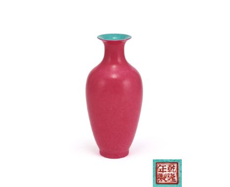 A Chinese ruby red vase, Republican, of slender form, sweeping towards a cylindrical neck below a wide rim, the exterior cove