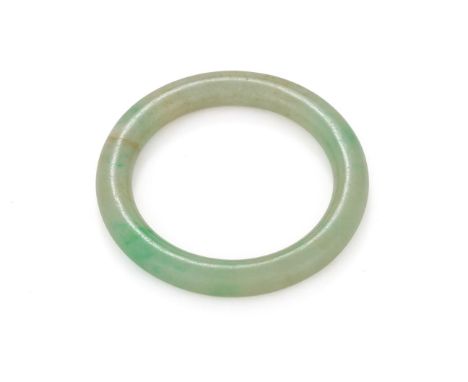 A Chinese jade bangle, Qing dynasty, overall 7.8cm diameter and inner measurement 5.7cm diameter Provenance: By Family descen