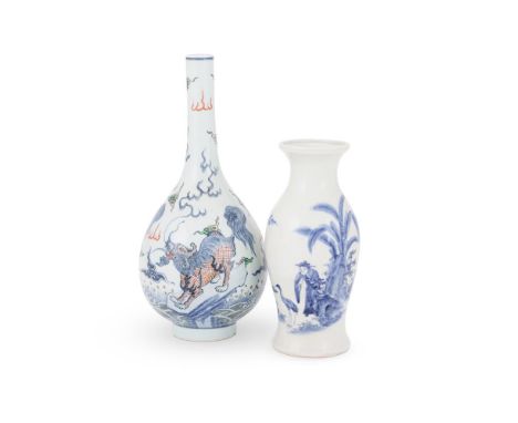 A Chinese Doucai 'Mythical beasts' bottle vase, 19th century, painted to the exterior with three mythical beasts standing on 