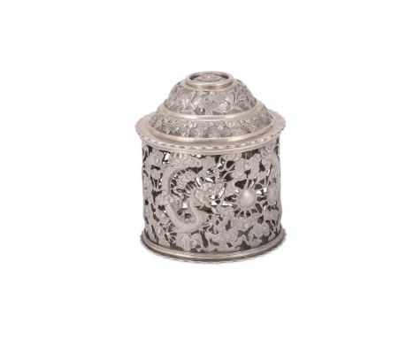 A Chinese Export silver 'dragon' box and cover, Wang Hing, Hong Kong, circa 1900, the pierced cylindrical body with dragons c
