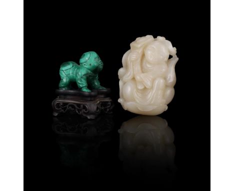 A Chinese celadon jade carving of a boy, late Qing dynasty or Republican, dressed in a loose robe, holding a Ruyi in his righ