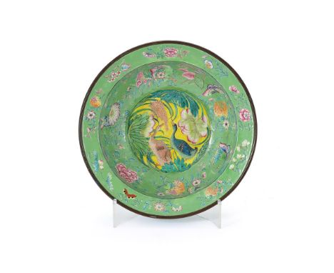 A Cantonese enamel basin, 19th century, the centre painted with a pair of geese on a yellow ground, green border painted with