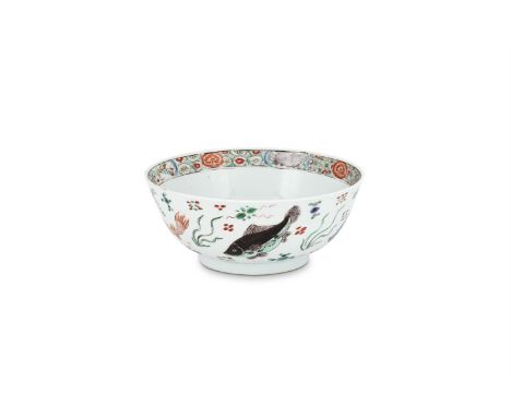 A Chinese Famille Verte 'Fish' bowl, Kangxi, painted to the exterior with different types of fish swimming amidst aquatic pla