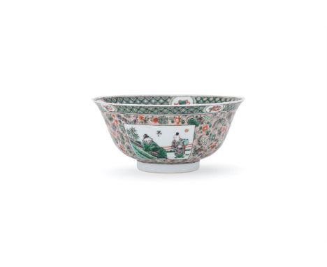 A Chinese Famille Verte bowl, 19th century, painted in Kangxi style to the exterior with panels of antiquities and scholars, 