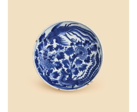 A Chinese blue and white 'phoenix' dish, Kangxi, densely decorated with two phoenixes amongst foliage, six character maker's 