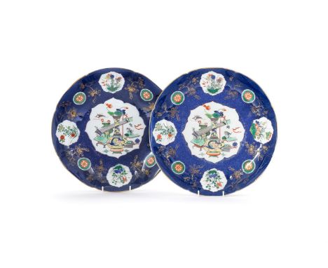 A pair of Chinese style powder blue Famille-Verte dishes, possibly Edme Samson, the centres painted within a petals-shaped pa