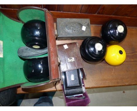 2 pairs of crown green bowl, 2 jacks in bags, folding camera, an antler and briar walking stick