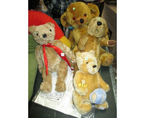 A Merrythought brown teddy bear; a Gund musical Winnie the Pooh, mohair; 2 similar teddy bears