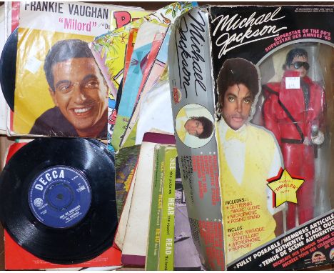 A Michael Jackson figure in 'Thriller' outfit, boxed; a selection of various singles
