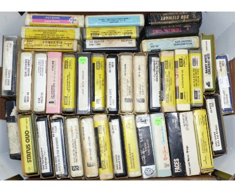 A collection of 8 track cartridges including Rolling Stones and the Beatles