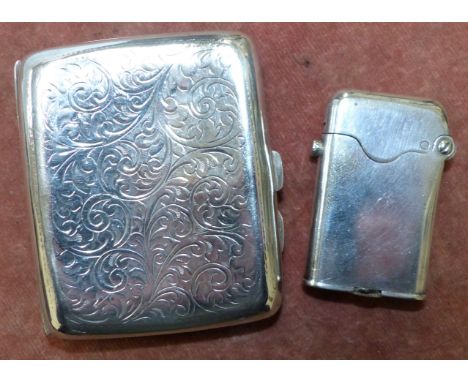 A silver cushion shaped cigarette case, Birmingham 1920; a Thorens patent cigarette lighter