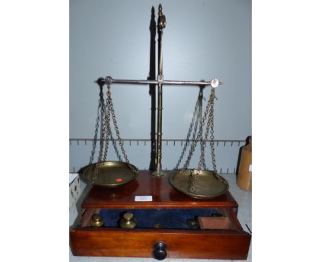 A 19th century brass 2 pan scale with mahogany plinth, fitted single drawer, with weights, height 20"