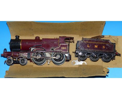 A tin plate '0' gauge clock work locomotive with tender 1185 in Burgundy livery