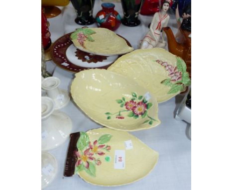Four Carltonware leaf dishes; a Spode "The Millennium" plate; a Spode candlestick and 2 similar; a figure of a reclining fema