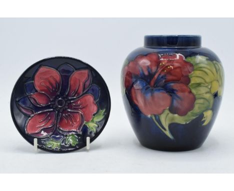 Moorcroft Anemone pin dish on blue background together with Hibiscus on blue ginger jar (missing lid) (2).  In good condition