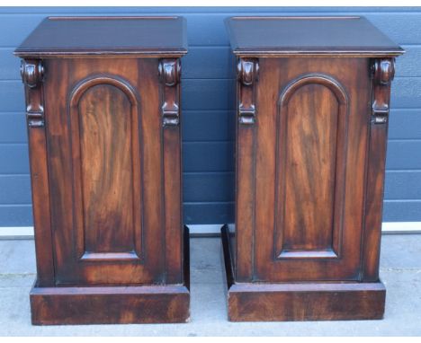 Victorian mahogany pair of bedside tables with scroll-like features, one with pull-out drawers with the other having single d