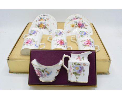 A Royal Crown Derby boxed Posies pattern coffee service, comprising of six cups and saucers, in the original card box and a f