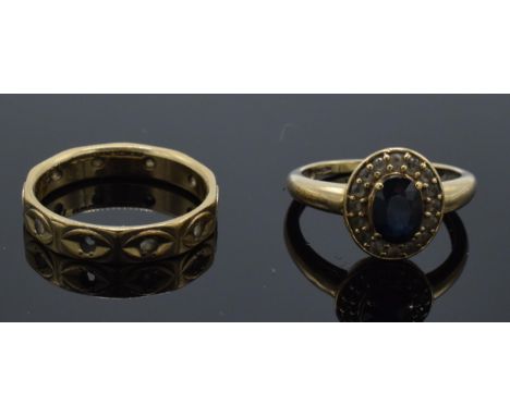 2 9ct gold rings, 5.7 grams, one with sapphire, one eternity ring (missing stones) (2).  