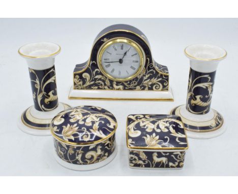 A collection of Wedgwood Cornucopia pottery to include a mantle clock, trinkets and a pair of candlesticks (5).  In good cond