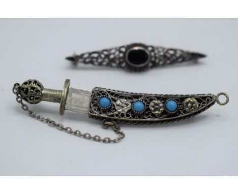 A silver dagger brooch together with a silver bar brooch (2).  