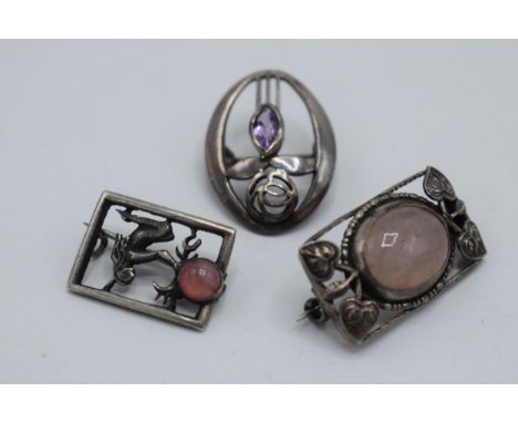 A trio of silver brooches to include a Mackintosh style item (3).  