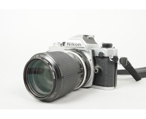 A Nikon FM SLR Camera, chrome, serial no 3248927, shutter working, meter responsive, timer working, body VG, with Zoom Nikkor