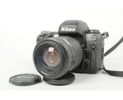 A Nikon F100 SLR Camera, serial no. 2 229 019, body G-VG, nick to top of prism, slight handling wear to grip, shutter working