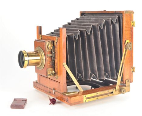 An early 20th Century mahogany and brass half-plate Field Camera,  with roller-blind shutter and non-original lens board, set