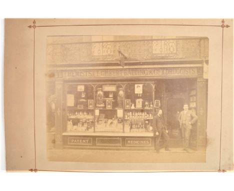 Ephemera relating to Godfrey Batting,  including albumen print of shop front ' T Gilbert Batting &amp; Co Chemists, Druggists